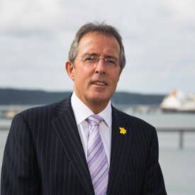 Portrait of Port of Milford Haven Chair Chris Martin with Waterway in background