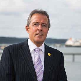 Portrait of Port of Milford Haven Chair Chris Martin with Waterway in background