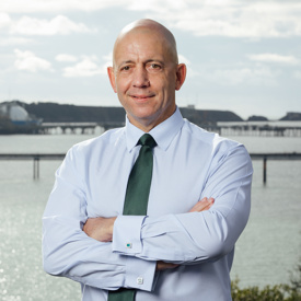 Tom Sawyer, Chief Executive of the Port of Milford Haven with the Waterway in the background