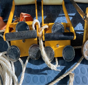 A yellow object with a rope around it

AI-generated content may be incorrect.