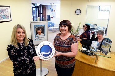 Anna Malloy, PR & Communications Manager at the Port of Milford Haven (left), is shown the new reception area by staff member Judith Williams (right)